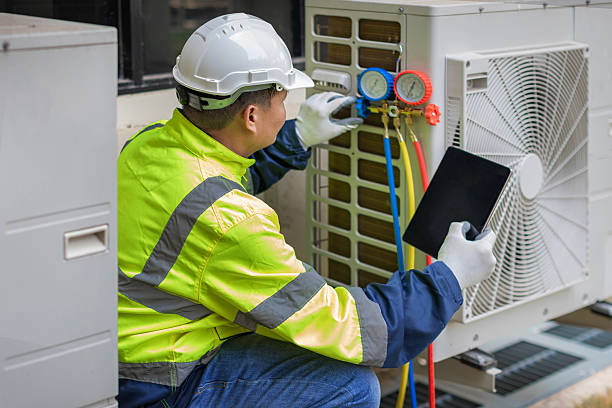 Professional Hvac Installation technician working in Magnolia Springs, AL
